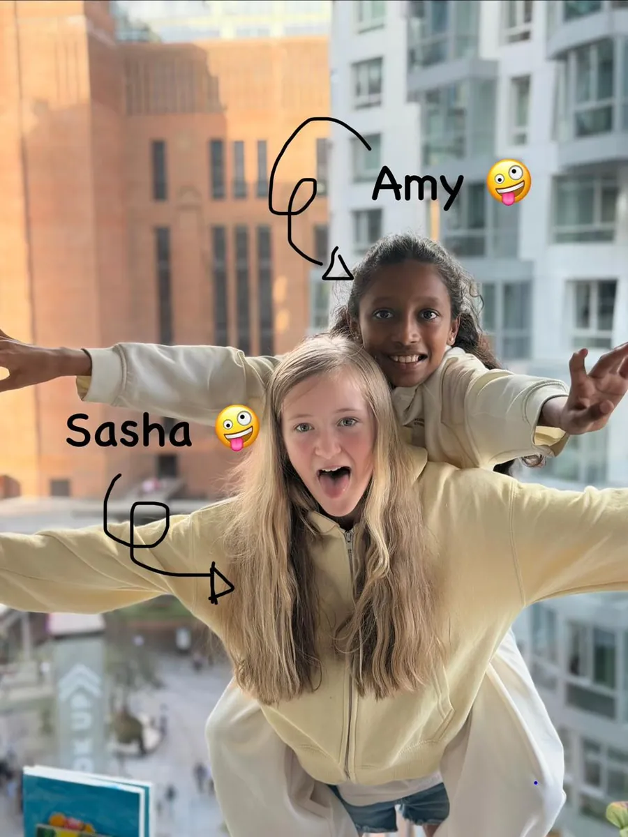 Squish founders Amaaya (Amy) and Sasha, arms stretched out wide